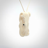 This is a beautiful little hand carved octopus pendant. It is a very cute little pendant that we have carved in natural, untreated bone. We provide these with meringue adjustable cords and shipping is included worldwide.